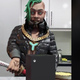 FN Meka the AI rapper about to cut into an Xbox Series X cake with a Katana.